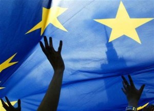 People wave a European Union flag